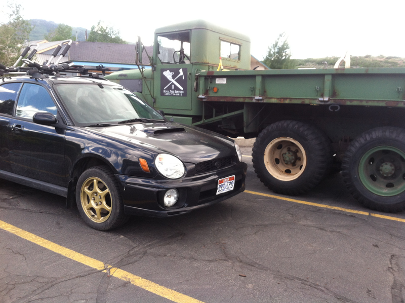 My car and a BIG BOI. Pretty sure mine fits in the bed of it.